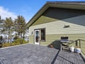 Spacious waterfront deck with BBQ grill where you can cook while enjoying stunning lake views and peaceful surroundings.