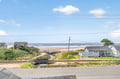 Coastal neighborhood with charming beachfront homes and direct beach access just steps away.