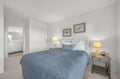 Your serene retreat awaits with a plush bed dressed in coastal blues, soft lighting, and soothing artwork. Step into the ensuite and sink into comfort after a day of exploration.
