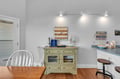 Your cozy dining nook features charming nautical touches and a welcoming atmosphere perfect for morning coffee or evening meals together.