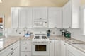 Your well-equipped kitchen awaits with granite countertops, a gas stove, and everything needed to prepare your favorite meals in the comfort of your rental.