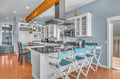Your spacious kitchen features granite counters, professional appliances, and a breakfast bar where you'll love gathering for morning coffee.