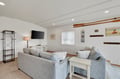 Sink into these plush gray sofas and enjoy your favorite shows on the large TV in this cozy living room.