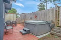 Soak your worries away in your private hot tub while enjoying the peaceful enclosed patio setting.