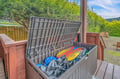 Outdoor storage chest on deck with mountain views, keeping your gear organized and protected during your stay.