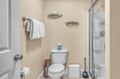 Step into your private bathroom with modern shower, fresh towels, and thoughtful amenities ready for your comfort.