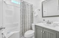 Step into your beautifully appointed bathroom with a sleek vanity, fresh towels, and modern fixtures for your comfort.