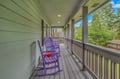 Settle into these charming purple rocking chairs on your covered porch, where afternoon breezes and peaceful neighborhood views create the perfect spot for your morning coffee.