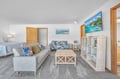 Relax in your spacious suite where coastal charm meets modern comfort. Sink into plush sofas while tropical artwork transports you to paradise.
