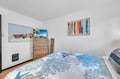 Slip into coastal calm in your bright bedroom, where beach-themed art and a comfy bed await. Unwind with your favorite show on the TV after a day of adventure.