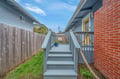 Charming elevated deck with rope railings connects to your private entrance, surrounded by a peaceful residential neighborhood.