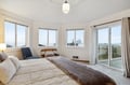 Your peaceful bedroom sanctuary features ocean views and direct balcony access for morning coffee with stunning coastal vistas.