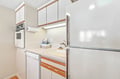 Your fully equipped kitchen features clean countertops, a built-in oven, dishwasher, and generous cabinet space—everything you need to whip up a quick breakfast or a leisurely homemade meal during your stay.