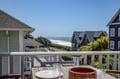 Coastal property offering tranquil ocean views over neighboring cottages, located steps from the beach in a serene coastal setting perfect for a seaside retreat.
