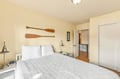 Sink into this inviting bedroom where coastal charm meets comfort. Decorative paddles add nautical character, while crisp linens and warm lighting create your peaceful retreat after exploring nearby beaches.