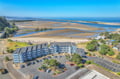 Stunning coastal property situated directly on expansive sandy beaches with tidal pools and ocean views.
