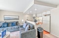 Settle into plush seating in your open living area, where modern comfort meets thoughtful design. The adjoining kitchen invites you to prepare meals at your leisure, with ample counter space and stainless appliances ready for your use.