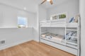 Your kids will love this bright bunkbed common area with comfortable bunk beds and cheerful blue bedding, perfect for family adventures.