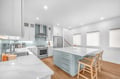 Your spacious kitchen features modern appliances, gleaming counters, and a breakfast bar where you'll start each day.