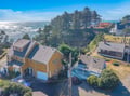 Coastal retreat perched above the Pacific, surrounded by towering pines in this charming oceanside neighborhood.
