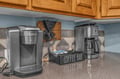 Start your morning right at this dedicated coffee station with a grinder and maker—everything you need to brew your perfect cup.
