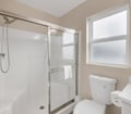 Refresh in your spotless bathroom with a modern shower and natural light from the frosted window ensuring complete privacy.