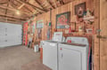 Your laundry needs are covered in this charming rustic space with full-size washer and dryer, plus convenient storage shelves.
