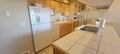 Your fully equipped kitchen offers everything you need to prepare fresh meals during your stay, with warm wood cabinets and ample counter space for cooking together.
