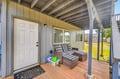 Your private covered patio invites relaxation with comfortable outdoor seating where you can unwind and enjoy peaceful moments.