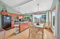 Your open kitchen flows seamlessly into the dining space, where morning coffee tastes better with garden views through bright windows.