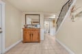 Step into your welcoming entryway with warm tile floors and charming rustic touches that make you feel instantly at home.