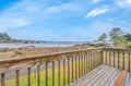 Stunning coastal property featuring expansive ocean views and private beach access from this scenic waterfront location.