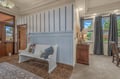 Step into a welcoming entryway with charming coastal details and natural light streaming through your windows, inviting you to settle in and relax.