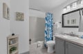 Relax in your coastal-inspired bathroom with fresh linens, beach-themed décor, and a refreshing shower. Everything you need to feel right at home.