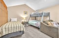 Settle into your cozy family room with comfortable beds and a relaxing sofa for everyone to unwind together.