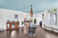 Relax beneath your stunning blue ceiling in this elegant space featuring a beautiful Moroccan chandelier and charming blue porcelain accents throughout.