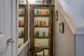 Your own quiet reading nook awaits with a curated collection of books and cozy seating for peaceful literary escapes.