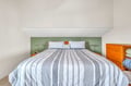 Slip into crisp linens in your cozy bedroom alcove, where soft lighting and modern comfort create the perfect retreat.