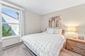 Sink into this plush bed draped in soft textured linens and wake to gentle daylight streaming through your window. Warm wood furnishings and thoughtful touches create a restful retreat for a peaceful night's sleep.