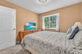Sink into this cozy bedroom where soft linens and warm lighting create your perfect retreat after exploring.