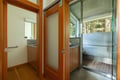 Step into your private sauna with sleek glass doors and natural wood accents, where relaxation awaits after your adventures.