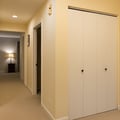 Spacious hallway with ample storage in your wardrobe, plus climate control to keep you comfortable throughout your stay. The nearby bedroom awaits with soft lighting and warmth.