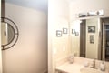 Step into your private bathroom, where warm lighting and thoughtful touches create a welcoming space to refresh and unwind after your adventures.