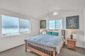 Wake to ocean waves crashing outside your bedroom window, where peaceful sleep meets dramatic sea views in this serene coastal retreat.