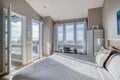 Wake up to breathtaking mountain views from your serene bedroom, where natural light floods through expansive windows and opens to your private balcony.