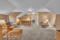 Your spacious upstairs retreat features comfortable seating and warm lighting, perfect for relaxing after exploring the area.