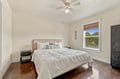 Drift off in this serene bedroom where crisp linens and soft textures invite restful nights, while natural light fills your mornings with warmth.
