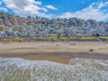 Charming coastal community with beach homes nestled along sandy shores, offering peaceful oceanfront living.