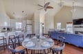 Gather around the dining table and enjoy meals together in this bright, open living space designed for comfort and connection.