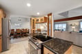 Your spacious open-plan kitchen flows seamlessly into the dining and living areas, creating the perfect space for gathering.